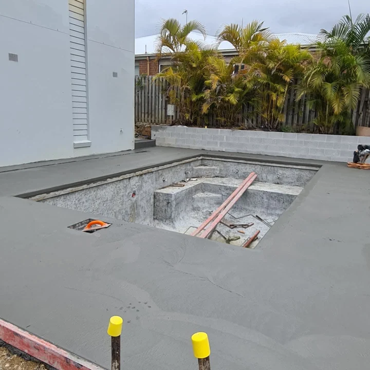 Freshly poured concrete pool surround at Tallebudgera